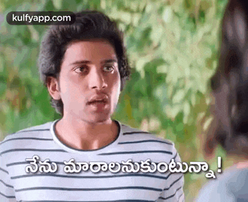 a man in a striped shirt is talking to a woman in a movie .