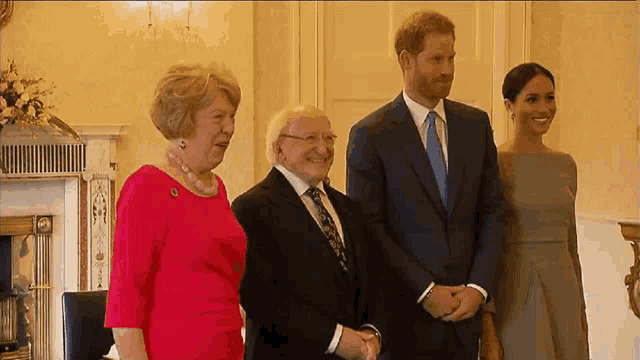 a group of people standing next to each other and smiling