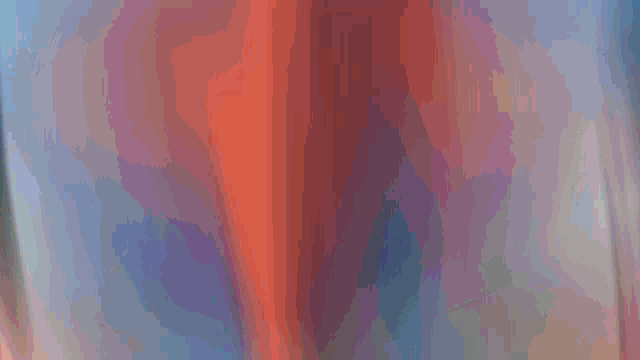 a blurred image of a person 's torso with a blue background