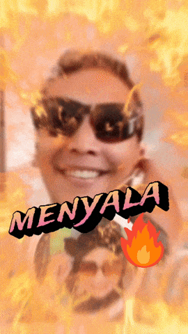 a man wearing sunglasses is surrounded by flames and the word menyala