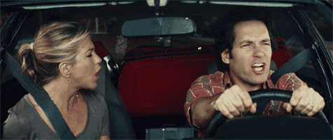 a man and a woman are sitting in a car