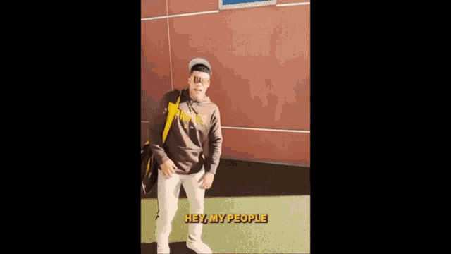 a man wearing a padres hoodie and sunglasses says good morning