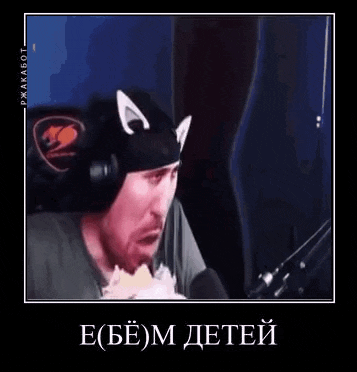 a man wearing a cat hat and headphones is talking into a microphone .