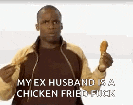 a man in a jacket is holding a chicken fried chicken .
