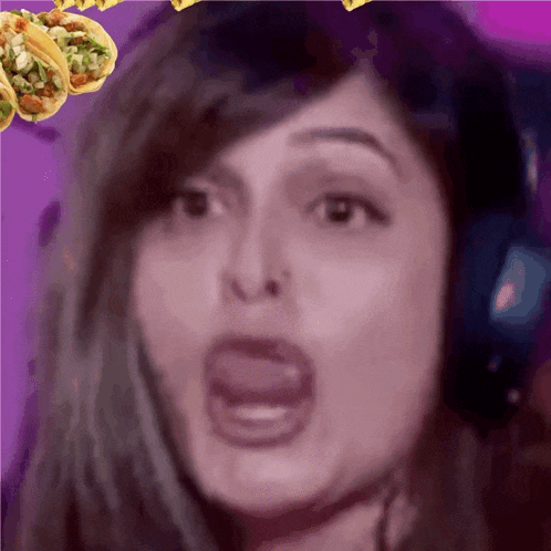 a close up of a woman with a taco in the background