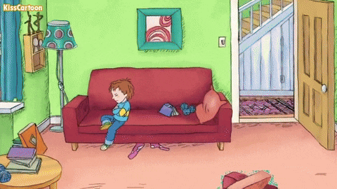 a cartoon of a boy sitting on a red couch with the words kisscartoon written above him