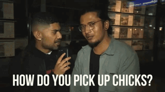 two men are talking to each other and one of them is asking the other how do you pick up chicks ?