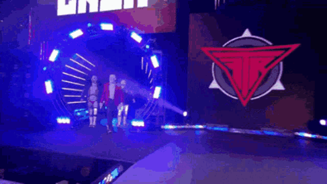 two wrestlers are walking down a hallway with money flying around them