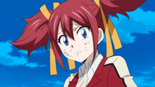 a girl with red hair and yellow ribbons on her head