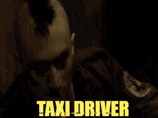 a man with a mohawk stands in a dark room with the words taxi driver on the bottom