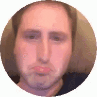 a man is making a funny face in a circle .