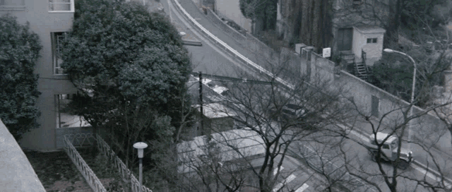 an aerial view of a street with a fence and a sign that says ' a ' on it