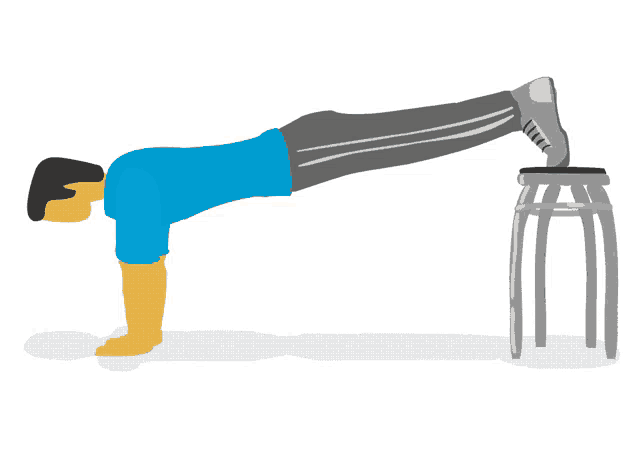 a man is doing push ups on a stool with his foot on it