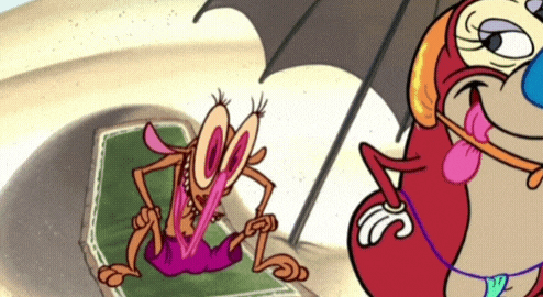 a cartoon character with a tongue sticking out is laying on a beach