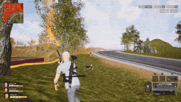 a screenshot of a video game shows a man holding a rifle in front of a burning tree