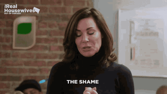 a woman says " the shame " in front of a real housewives logo