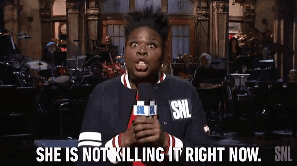 a woman holding a microphone that says she is not killing it right now on it