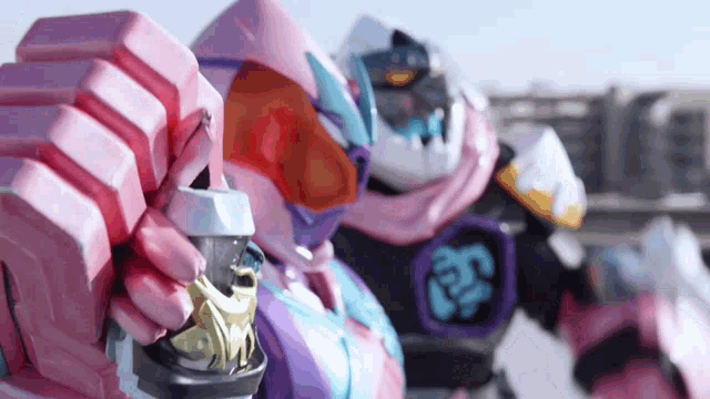 a close up of a robot holding a gun in its hands .