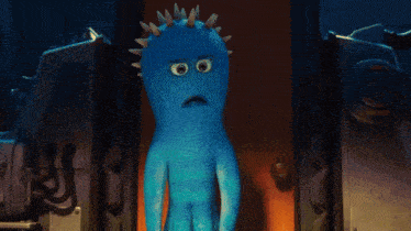 a blue monster with spikes on his head is standing in front of a door