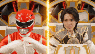 a red power ranger and a white power ranger are sitting next to each other in a room