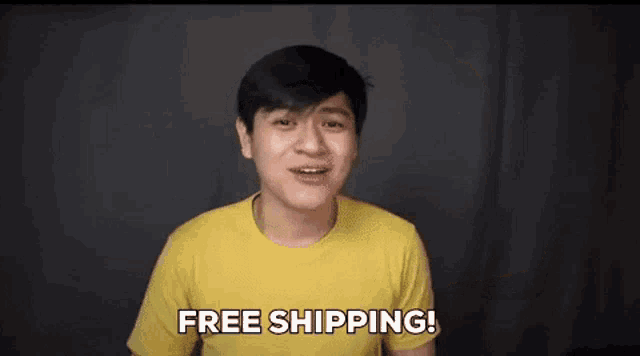 a man in a yellow t-shirt is pointing up and saying `` free shipping '' .
