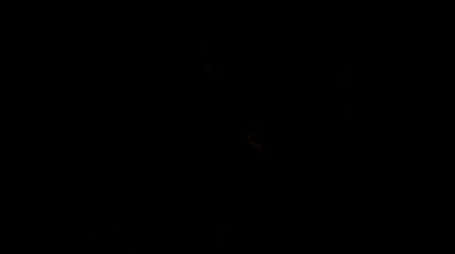 a woman with red hair is kissing a man on the cheek