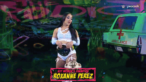 a woman in a wrestling outfit is standing in front of an ambulance