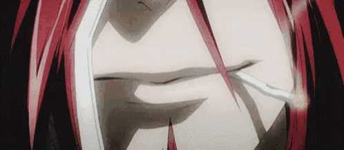 a close up of a person smoking a cigarette