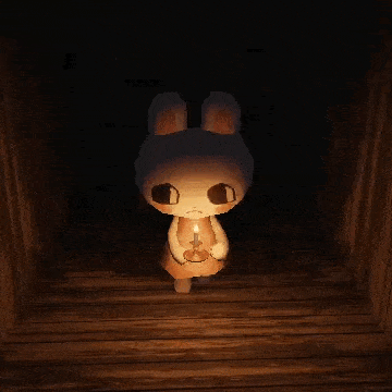 a bunny rabbit is holding a candle in a dark room .