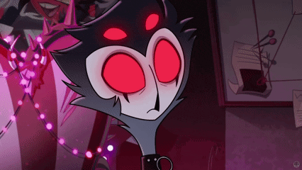 a close up of a cartoon character with red eyes .