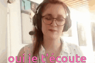 a woman wearing glasses and headphones says oui je t ' ecoute