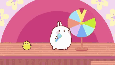 a cartoon rabbit is holding a microphone in front of a colorful spinning wheel .