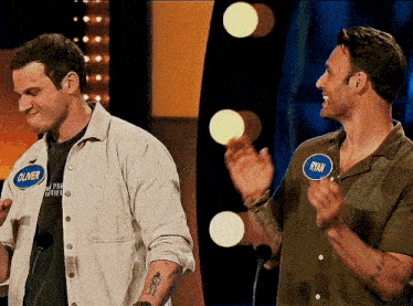 oliver and ryan are standing next to each other on a stage