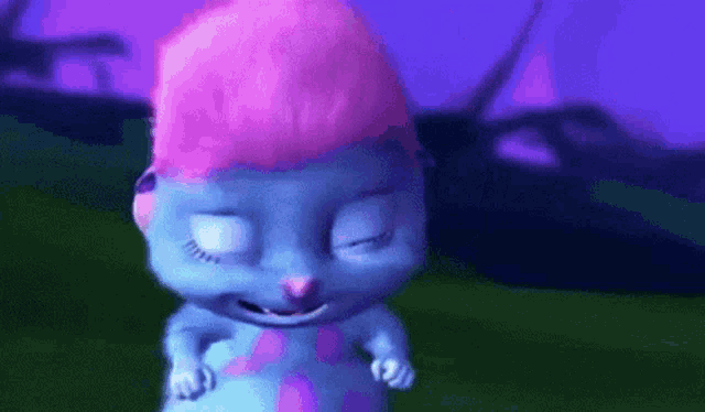 a blue cartoon character with pink hair is standing in a field .