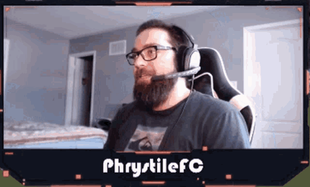 a man with a beard wearing headphones and a shirt that says phrytilefc