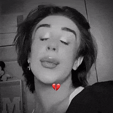 a woman with a broken heart on her neck