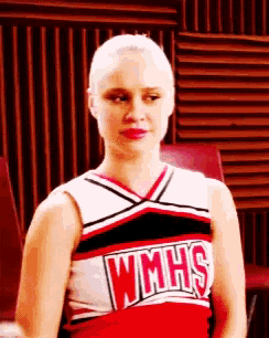 a cheerleader wearing a red and white wmhs uniform