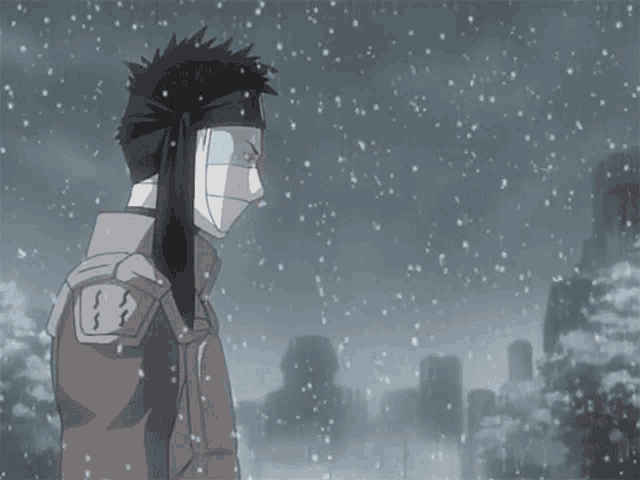 a man with a scarf around his neck is standing in the snow