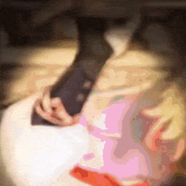 a blurred image of a person holding a pink item
