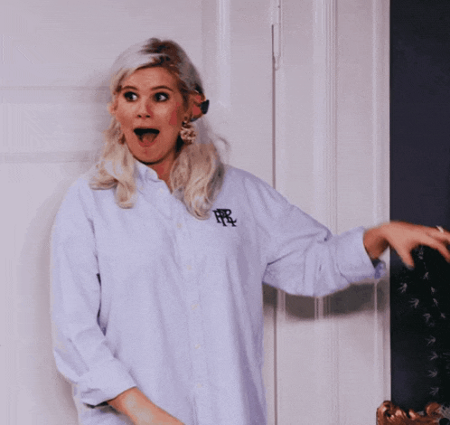 a woman wearing a white shirt with the letters ffr on it