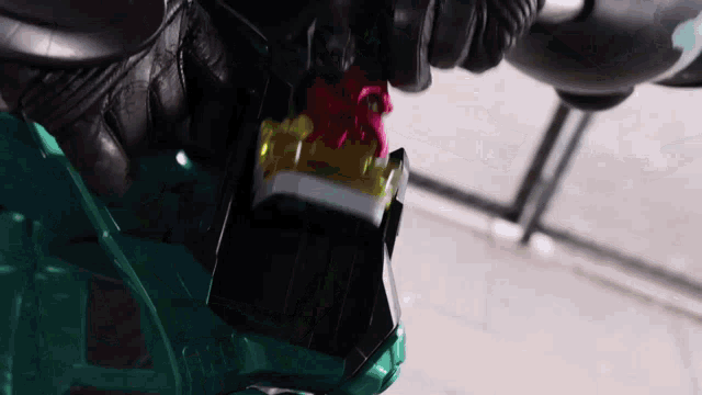 a person is holding a toy that looks like a sword