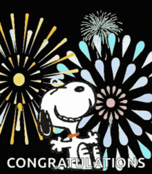 snoopy is surrounded by fireworks and the words congratulations