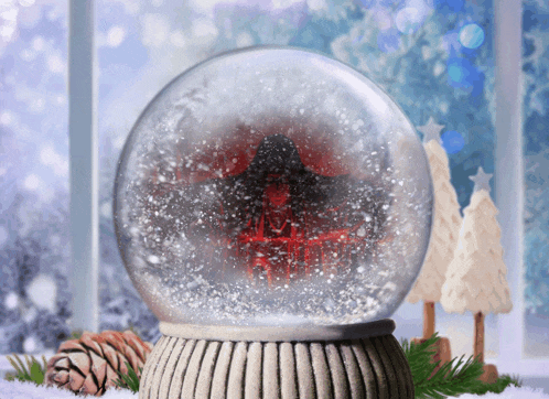 a snow globe with a tree inside of it