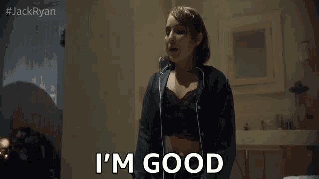 a woman in a bra says i 'm good in a bathroom
