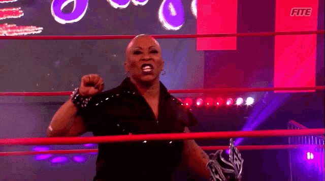 a female wrestler in a ring with the word fite on the bottom