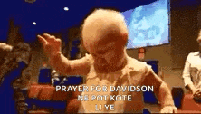 a baby is dancing in a church with the words prayer for davidson on the bottom