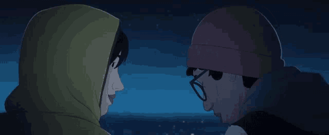 a man and a woman are looking at each other .