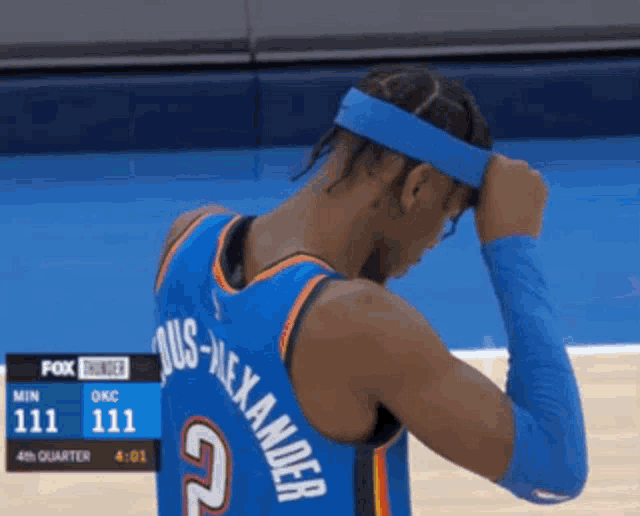 a basketball player wearing a headband with the name alexander on the back