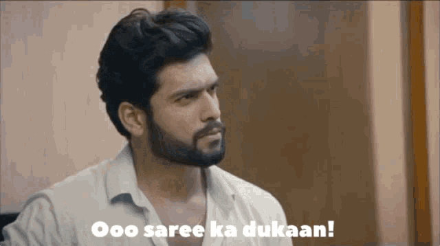 a man with a beard says ooo saree ka dukaan