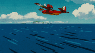 a red plane with the number 8 on the side is flying over a body of water